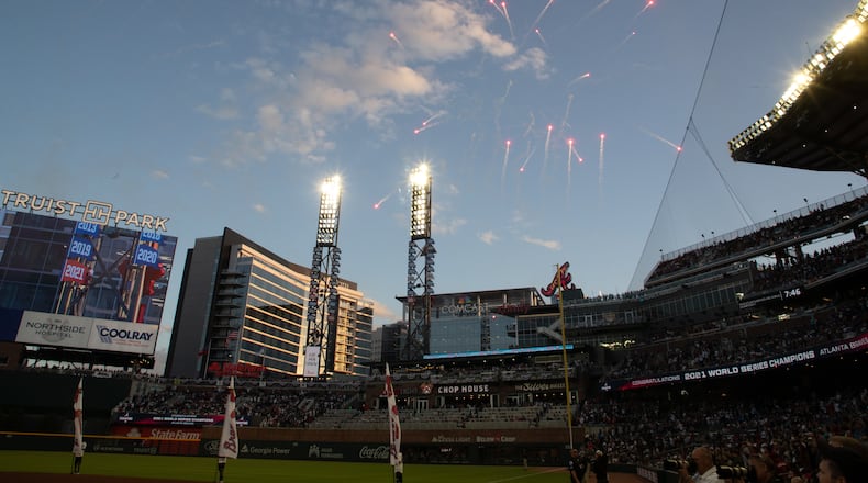 Fireworks explode after the 2021 pennant is revealed before the start of the game with the Cincinnati Reds at Truist Park Thursday, April 7, 2022 (Steve Schaefer / steve.schaefer@ajc.com)
