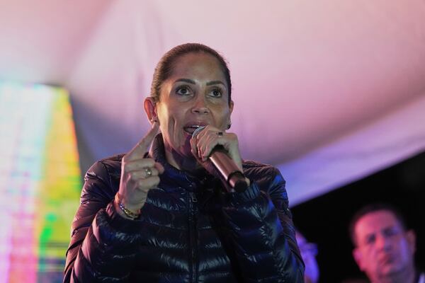 Presidential candidate Luisa Gonzalez addresses supporters as early returns show President Daniel Noboa in the lead in the presidential election runoff in Quito, Ecuador, Sunday, April 13, 2025. (AP Photo/Dolores Ochoa)