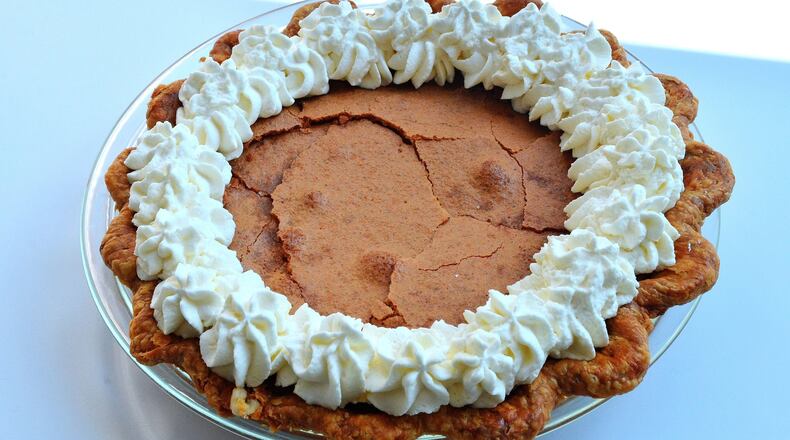 Brown Butter Chess Pie, developed by Briana Carson of Crave Pie Studio, wins even more fans with its bourbon whipped cream topping. STYLING BY BRIANA CARSON / CONTRIBUTED BY CHRIS HUNT PHOTOGRAPHY