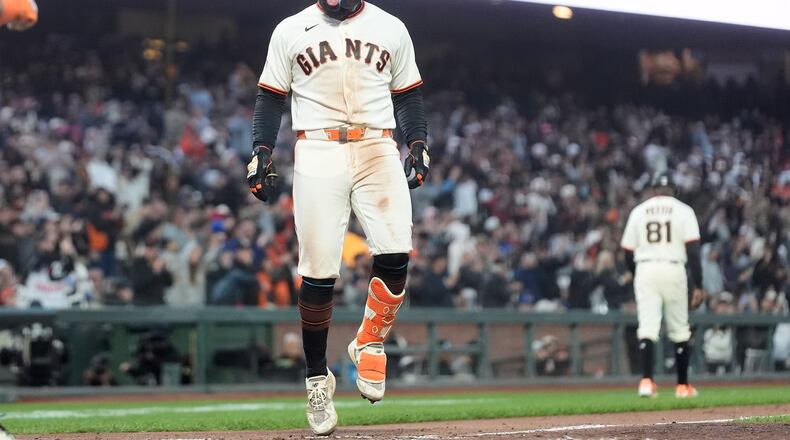 San Francisco Giants' Heliot Ramos reacts after hitting a three-run home during the sixth inning of a baseball game against the Toronto Blue Jays Monday, July 6, 2026, in San Francisco. (AP Photo/Jeff Chiu)