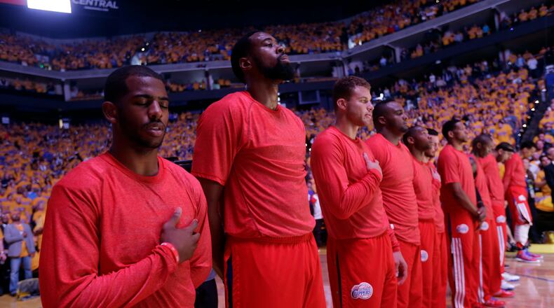 Los Angeles Clippers players listen to the national anthem wearing their warmup jerseys inside out to protest alleged racial remarks by team owner Donald Sterling before Game 4 of an opening-round NBA basketball playoff series against the Golden State Warriors on Sunday, April 27, 2014, in Oakland, Calif. (AP Photo/Marcio Jose Sanchez) Clippers players wore their warmup jerseys inside out during the national anthem Sunday to protest alleged racial remarks by team owner Donald Sterling. (AP photo)