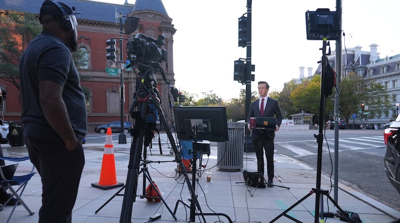 Vaughn Hillyard, White House correspondent for MS NOW, does a report from near the White House,, Monday, Sept. 21, 2026, in Washington. (AP Photo/Mark Schiefelbein)