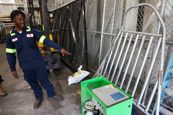 Welding apprentice Keandre Kelly shows one of the pieces he’s worked to cover a drain in the welding shop at Hartsfield-Jackson Atlanta International Airport, Thursday, July 17, 2025, in Atlanta. Kelly graduates from the two-year apprenticeship program Friday. (Jason Getz/AJC)