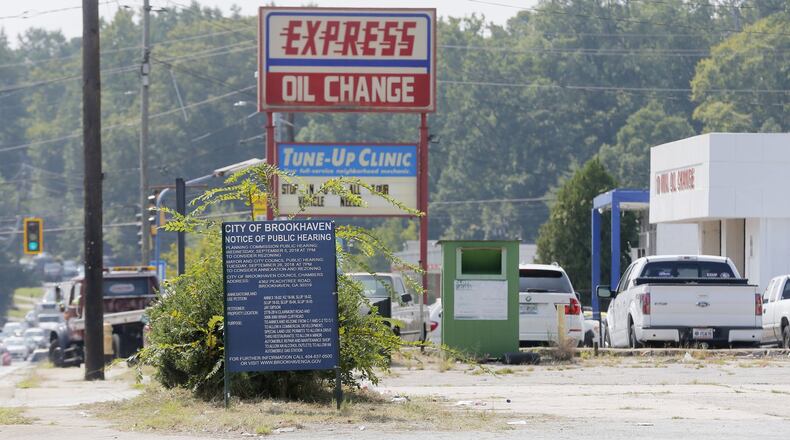 A developer wants to build a RaceTrac gas station and Wendy’s on the corner of Clairmont Road and Briarcliff Road in unincorporated DeKalb, replacing the car repair and service shops located there now. The land would be annexed into Brookhaven. BOB ANDRES /BANDRES@AJC.COM