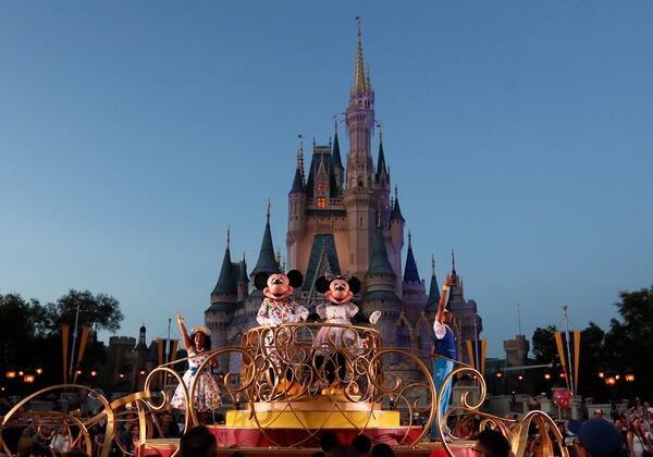 Disney officials said in a statement that extra hand sanitizers were being placed throughout their four parks and more than two dozen hotels.