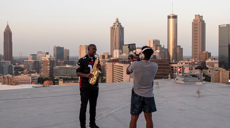 Renowned saxophonist Mike Phillips performed the national anthem, recorded to be played at Sunday's Falcons game, on the roof of Mercedes-Benz Stadium last week. (Photo by Jim Blackburn, provided by AMBSE)