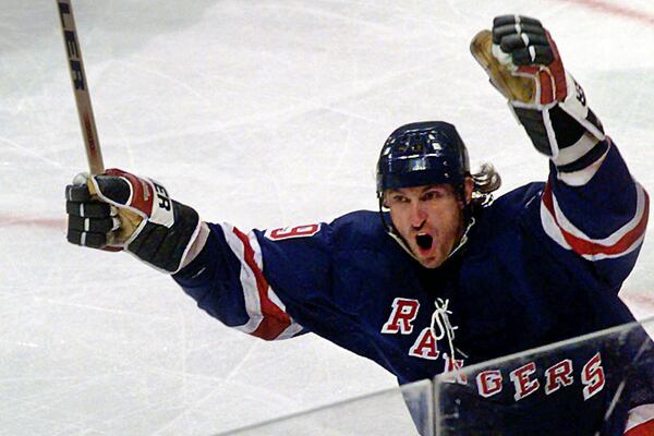 FILE - New York Rangers' Wayne Gretzky (99) celebrates scoring a goal in the third period during an NHL hockey game against the Dallas Stars in Dallas, Friday, Nov. 7, 1997. (AP Photo/LM Otero, File)