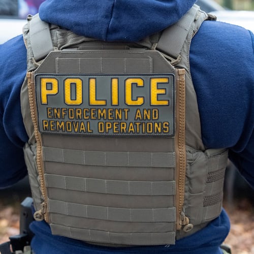 FILE - Federal law enforcement officers with Immigration and Customs Enforcement (ICE) and Enforcement and Removal Operations (ERO) conduct a traffic stop and detain people, Nov. 17, 2025, in Washington. (AP Photo/Alex Brandon, File)