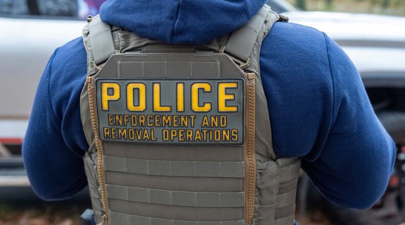 FILE - Federal law enforcement officers with Immigration and Customs Enforcement (ICE) and Enforcement and Removal Operations (ERO) conduct a traffic stop and detain people, Nov. 17, 2025, in Washington. (AP Photo/Alex Brandon, File)
