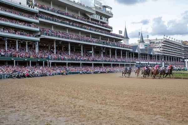 Photographer Lili Kobielski captures the famed two-spired grandstand and the action at Churchill Downs in this photo from "At the Derby: Kentucky's Grandest Celebration of Fashion." (Courtesy of Lili Kobielski) 