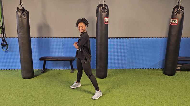 Elisha McKenzie, a 21-year-old Suwanee woman with Down syndrome, works as a certified Zumba instructor. Courtesy of Richard McKenzie