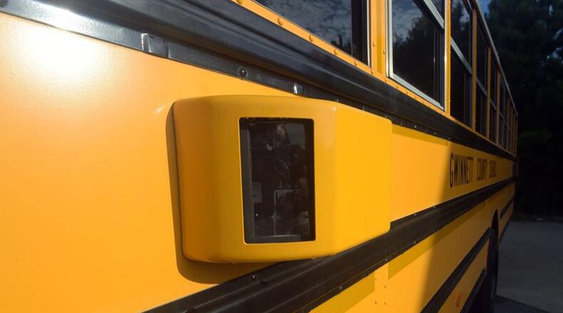 Gwinnett County started using video cameras like this one to record drivers passing stopped school buses in 2014. Cherokee County school officials plan a pilot program this spring to try out the cameras on their own buses. KENT D. JOHNSON/AJC FILE