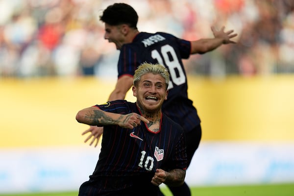 United States midfielder Diego Angel Luna (10) celebrates next to midfielder Maximilian Michael Arfsten (18) after scoring during the first half of a CONCACAF Gold Cup quarterfinals soccer match against Costa Rica, Sunday, June 29, 2025, in Minneapolis. (AP Photo/Abbie Parr)