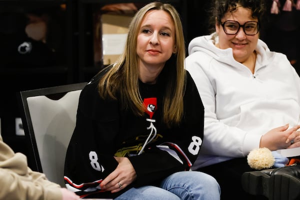 Jordan Fischer listens during the “Heated Rivalry” discussion at All the Tropes Bookstore in Atlanta. Fischer has built a popular book Instagram account for queer romance novels. (Abbey Cutrer/AJC)