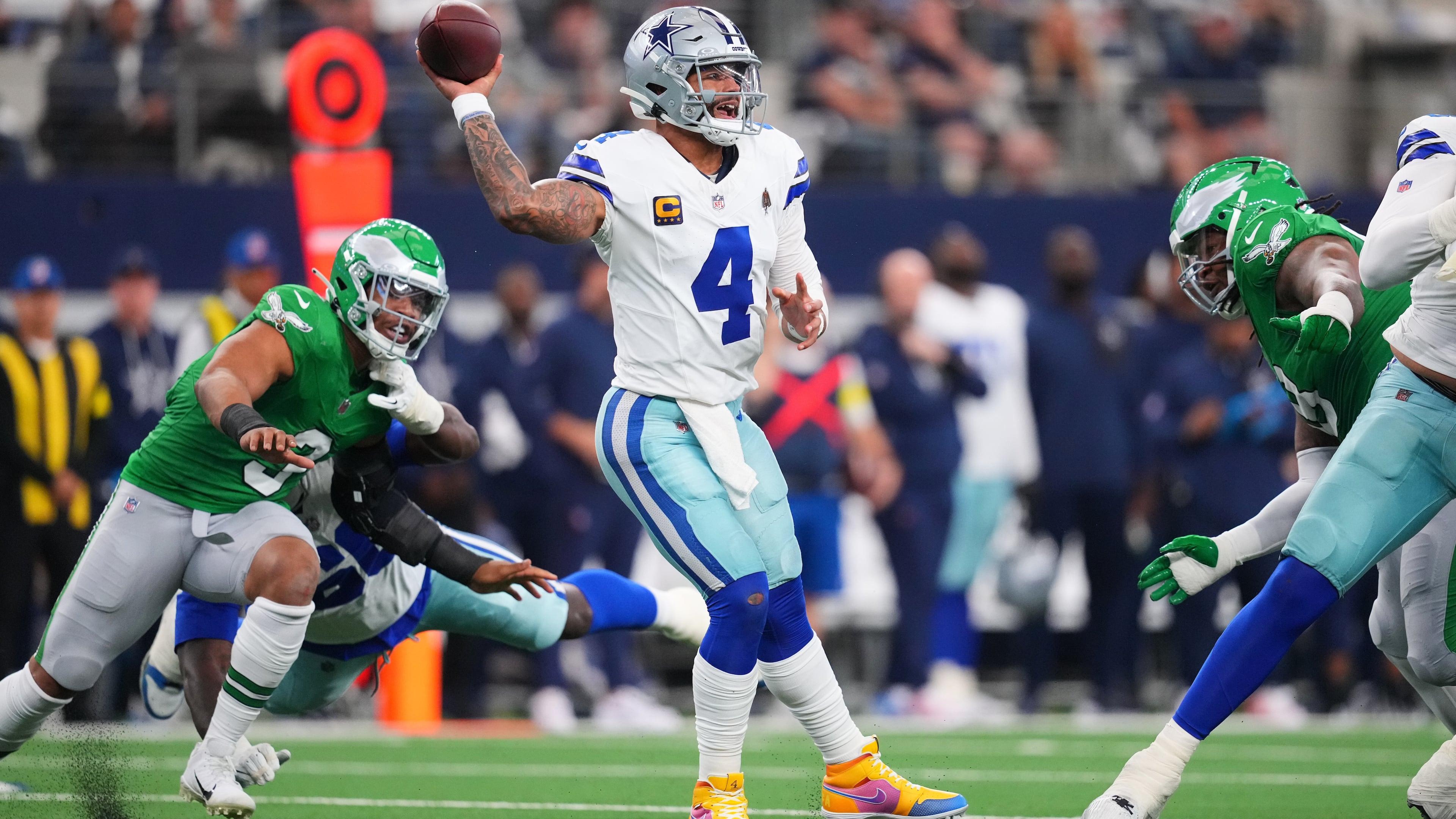 Dallas Cowboys quarterback Dak Prescott (4) throws a pass during the first half of an NFL football game against the Philadelphia Eagles, Sunday, Nov. 23, 2025, in Arlington, Texas. (AP Photo/Julio Cortez)