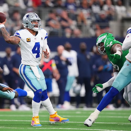 Dallas Cowboys quarterback Dak Prescott (4) throws a pass during the first half of an NFL football game against the Philadelphia Eagles, Sunday, Nov. 23, 2025, in Arlington, Texas. (AP Photo/Julio Cortez)