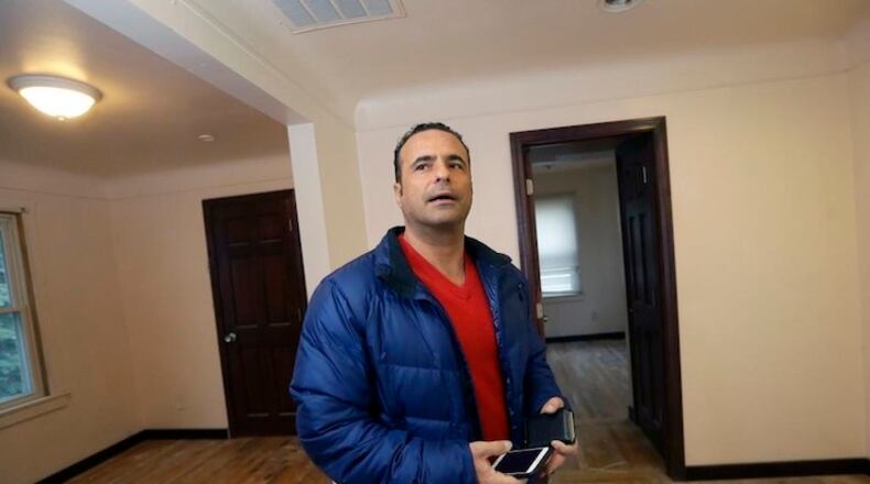 In this April 7, 2016, Nedal Tamer stands inside a house he is renovating in Dearborn, Mich. Tamer feels that, as a supporter of Donald Trump’s bid for the presidency, he is in the minority among Muslim Americans. He’s comfortable with his position, yet a little confounded that he doesn’t have more company. A small number of Muslims find comfort, not concern, in Trump’s strong stance on immigrants _ seeing it as proof he could better contain extremists than other candidates. (AP Photo/Carlos Osorio)