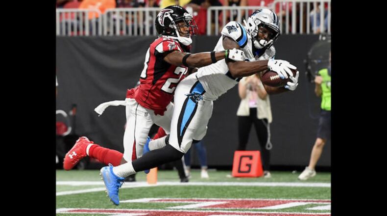 Carolina Panthers wide receiver DJ Moore (12) runs against Atlanta Falcons defensive back Jordan Richards (29) during the second half of an NFL football game, Sunday, Sept. 16, 2018, in Atlanta. Moore scored a touchdown on the play. The Atlanta Falcons won 31-24. (AP Photo/John Bazemore)