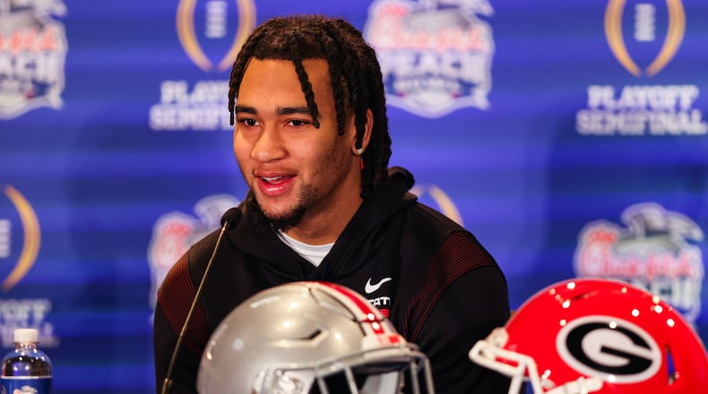 Ohio State quarterback C.J. Stroud speaks during a press conference on  Tuesday, Dec. 27, in Atlanta. OSU will face Georgia in the 2022 College Football Playoff Semifinal at the Chick-fil-A Peach Bowl. (Jason Parkhurst via Abell Images for the Chick-fil-A Peach Bowl)