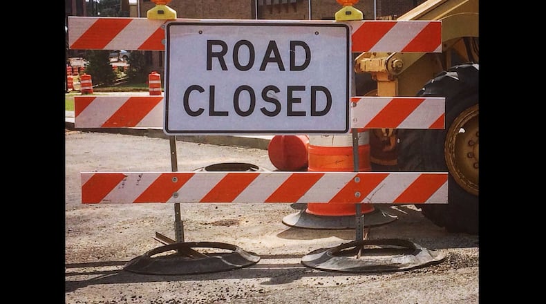 A "road closed" sign blocks the entrance to a street in north Fulton County.