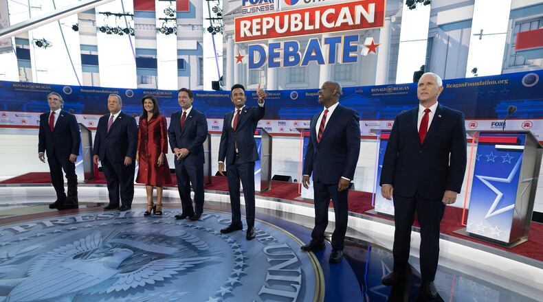 GOP presidential candidates, from left, Doug Burgum, Chris Christie, Nikki Haley, Ron DeSantis, Vivek Ramaswamy, Tim Scott and Mike Pence meet the crowd before the start of the second GOP debate Wednesday at the Ronald Reagan Presidential Library in Simi Valley, Calif. (Myung J. Chun/Los Angeles Times/TNS)