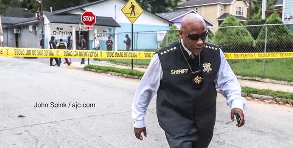 Clayton County Sheriff Victor Hill arrives on scene after a shooting suspect killed himself in northwest Atlanta on Wednesday morning.