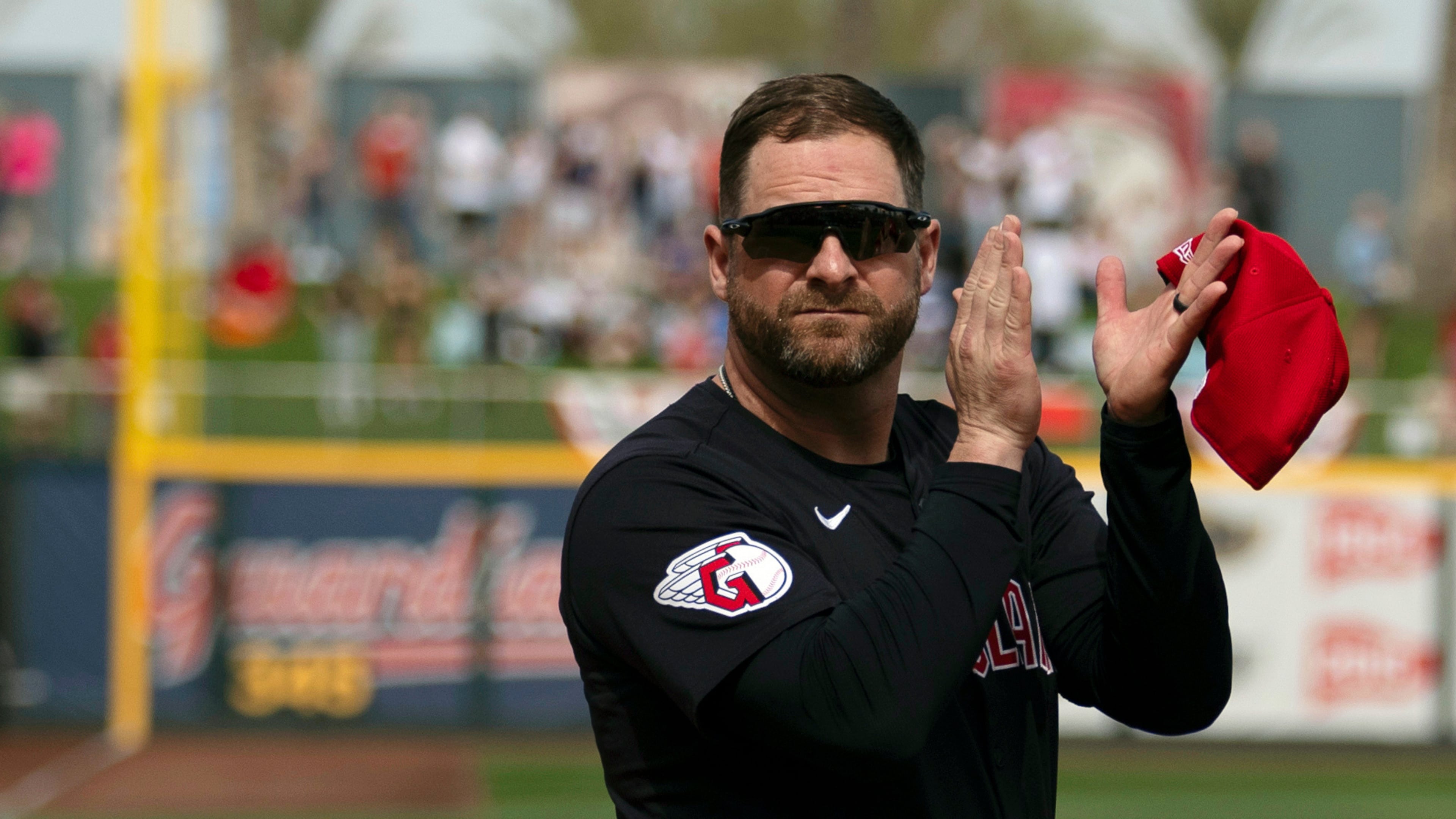 FILE - Cleveland Guardians manager Stephen Vogt turns to acknowledge veterans before the start of a spring training baseball game against the Cincinnati Reds, Feb. 24, 2024, in Goodyear, Ariz. (AP Photo/Carolyn Kaster, File)