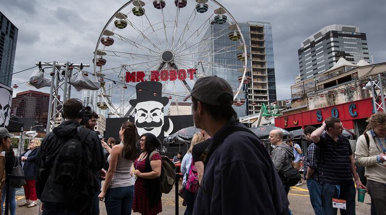 USE THIS PHOTO
SXSW Interactive began Friday, March 11, 2016 and the crowd began to gather around various locations in downtown Austin. A Mr. Robot ferris wheel stands at the corner of 4th Street and Congress Avenue. According to IMDb Mr. Robot is about "Young, anti-social computer programmer Elliot works as a cybersecurity engineer during the day, but at night he is a vigilante hacker."  LAURA SKELDING/AMERICAN-STATESMAN