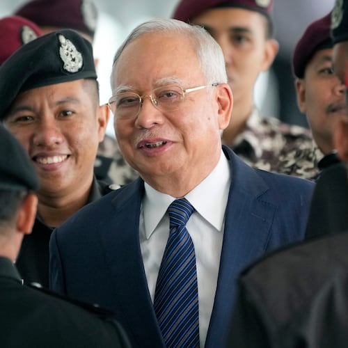 FILE - Former Malaysian Prime Minister Najib Razak arrives at the Kuala Lumpur High Court complex escorted by prison officers in Kuala Lumpur, Malaysia, on April 4, 2024. (AP Photo/Vincent Thian, File)
