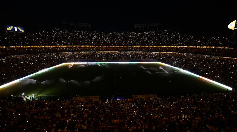 Fans take part in a light show with their mobile phones during halftime in the World Cup round of 32 soccer match between Colombia and Ghana in Kansas City, Mo., Friday, July 3, 2026. (AP Photo/Reed Hoffmann)