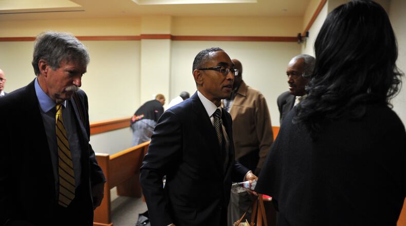 Suspended DeKalb County CEO Burrell Elliss leaves court after Judge Courtney Johnson declared a mistrial when the jury was unable to reach a verdict on Tuesday October 21, 2014. Eills was charged with 13 counts, including bribery, theft, extortion and perjury.