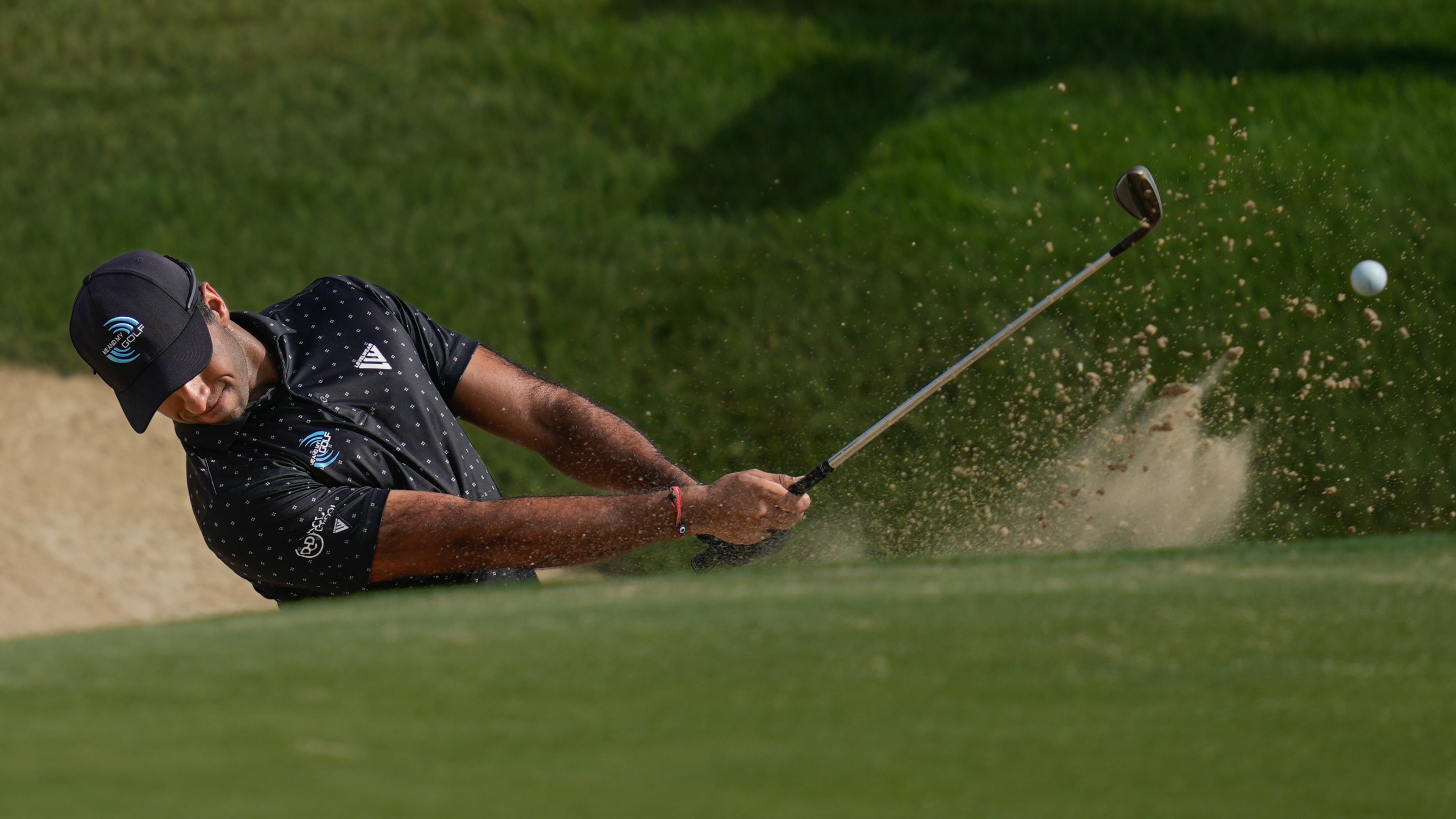 Aaron Rai of England hits a shot from a bunker on the 7th hole during the third round of the Abu Dhabi Golf Championship in Abu Dhabi, United Arab Emirates, Saturday, Nov. 8, 2025. (AP Photo/Altaf Qadri)