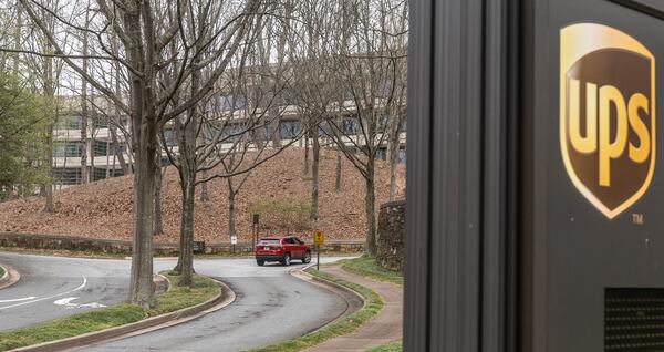 Cars arrive at 55 Glenlake Parkway NE, in Sandy Springs, Georgia, where office workers at UPS streamed back into work on March, 4, 2024, the first day a new policy requiring them to come into work in person five days a week took effect. (John Spink/The Atlanta Journal-Constitution/TNS)