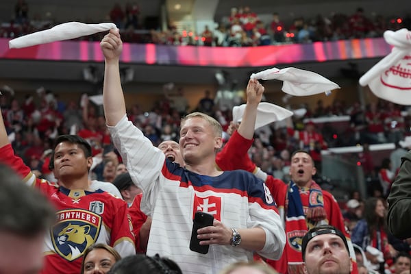 Florida Panthers fans celebrate a goal by center Sam Reinhart during the second period of Game 6 of the NHL hockey Stanley Cup Final against the Edmonton Oilers Tuesday, June 17, 2025, in Sunrise, Fla. (AP Photo/Lynne Sladky)