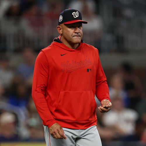 FILE - Washington Nationals interim manager Miguel Cairo walks out to the mound to make a pitching change in the seventh inning of a baseball game against the Atlanta Braves, Tuesday, Sept. 23, 2025, in Atlanta. (AP Photo/Colin Hubbard, File)