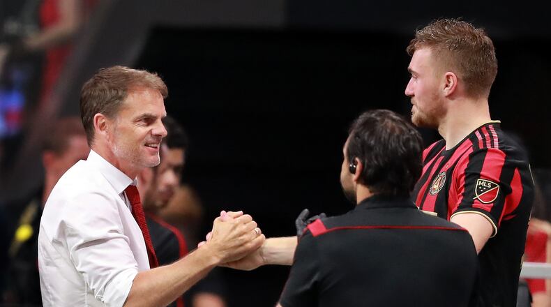 May 12, 2019 Atlanta: Atlanta United head coach Frank de Boer and midfielder Julian Gressel celebrate a 1-0 victory over Orlando City in a MLS soccer match on Sunday, May 12, 2019, in Atlanta. Curtis Compton/ccompton@ajc.com