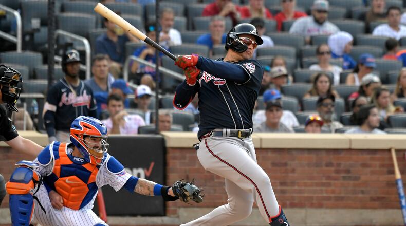 Joc Pederson follows through on a double that scored Guillermo Heredia in the third inning of Monday's doubleheader against the Mets in New York.
