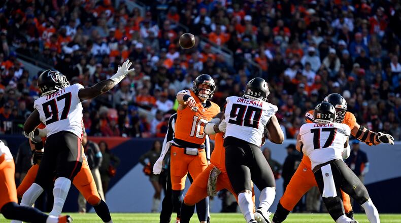 Bo Nix (10) of the Denver Broncos fires the ball to Devaughn Vele (17) during the first quarter against the Atlanta Falcons at Empower Field at Mile High in Denver on Sunday, Nov. 17, 2024. (Eric Lutzens/The Denver Post/TNS)