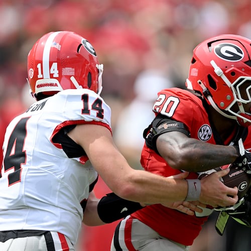 Georgia quarterback Gunner Stockton hands off to running back Dwight Phillips Jr. during the G-Day spring football game April 18, 2026. (Hyosub Shin/AJC)