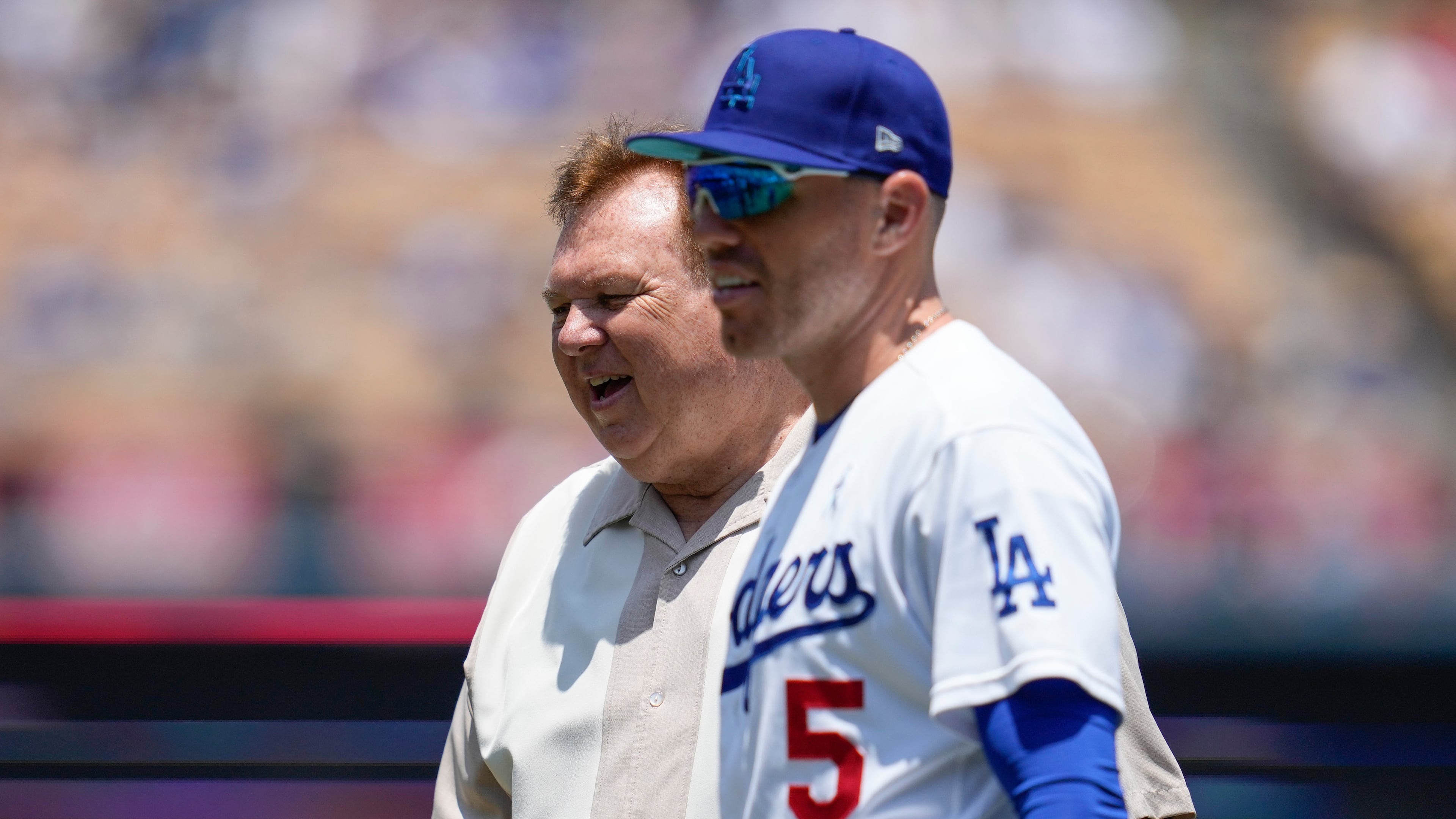 FILE - Los Angeles Dodgers first baseman Freddie Freeman (5) on the field walks with his father, Fred Freeman, before a baseball game against the San Francisco Giants in Los Angeles, Sunday, June 18, 2023. (AP Photo/Ashley Landis, File)