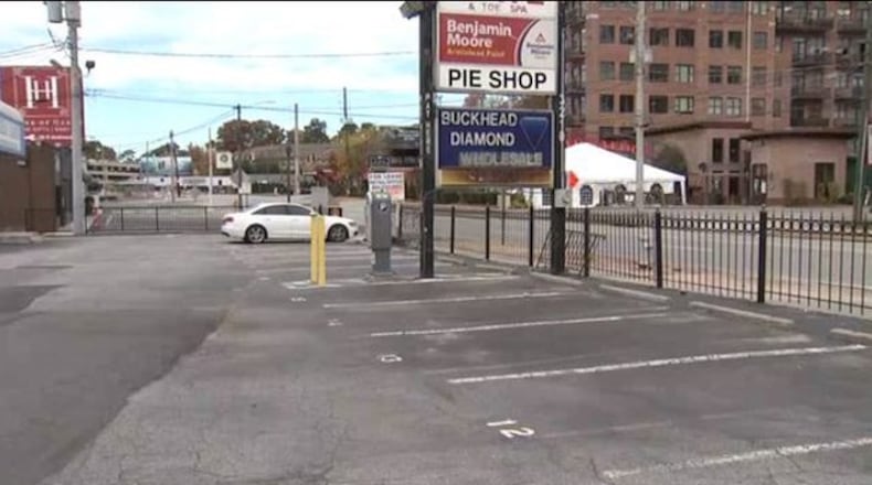 This parking lot in Buckhead is where a reported shooting happened between a booting company employee and the driver of a booted car. No arrests have been made in the incident. (Photo: Channel 2 Action News)