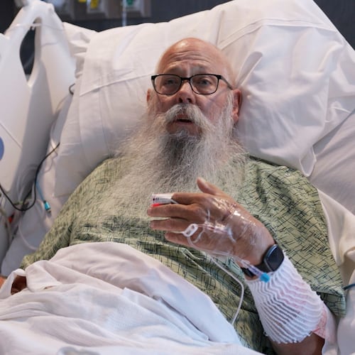 This image taken from Bozeman Health video shows Carl McDaniel speaking from in a hospital bed at Bozeman Health on July, 13, 2026, in Bozeman Mont., after he was hit by a bison in Yellowstone National Park. (Bozeman Health via AP)