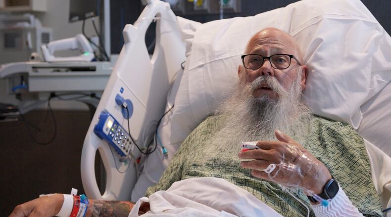 This image taken from Bozeman Health video shows Carl McDaniel speaking from in a hospital bed at Bozeman Health on July, 13, 2026, in Bozeman Mont., after he was hit by a bison in Yellowstone National Park. (Bozeman Health via AP)