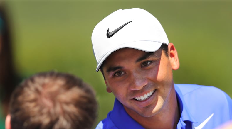 Jason Day chats with a patron after his practice round for the Masters at Augusta National Golf Club on Tuesday. (Curtis Compton/ccompton@ajc.com)