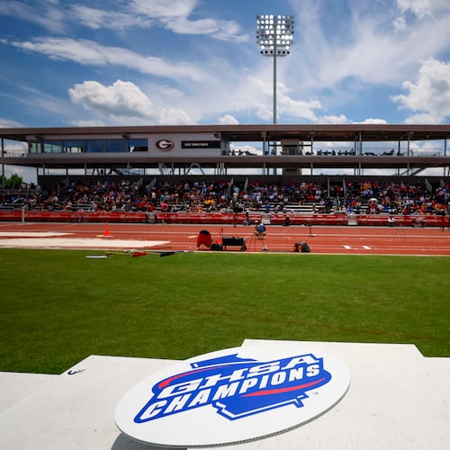 A GHSA logo is seen on the athletes’ podium during the boys 1,600 meters at the Class A Division II GHSA track and field state championships Monday, May 11, 2026, at Spec Towns Track at the University of Georgia in Athens. (Miguel Martinez/AJC)