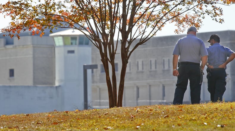Prison officials survey the grounds of the Federal Penitentiary in southeast Atlanta. (JOHN SPINK/ jspink@ajc.com/ 2011 file photo)