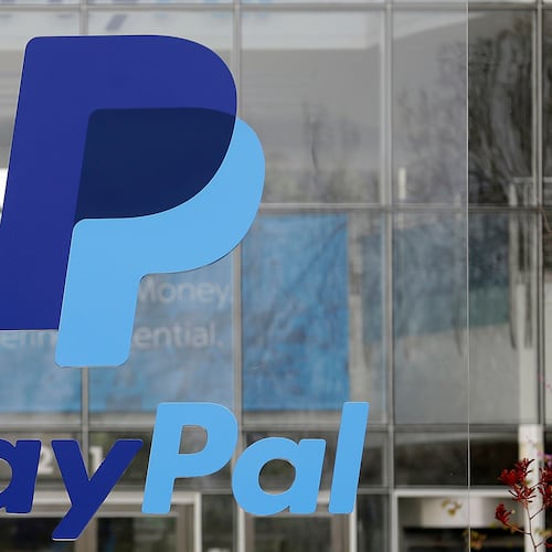 FILE - The PayPal logo hangs displayed outside their company headquarters on March 10, 2015, in San Jose, Calif. (AP Photo/Jeff Chiu, File)