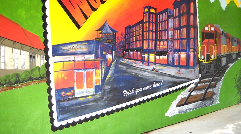 A wall mural greets visitors to downtown Woodstock. The city has set the first public meeting on its comprehensive plan update for 6 p.m., Oct. 19, at The Chambers at City Center, 8534 Main St. AJC FILE