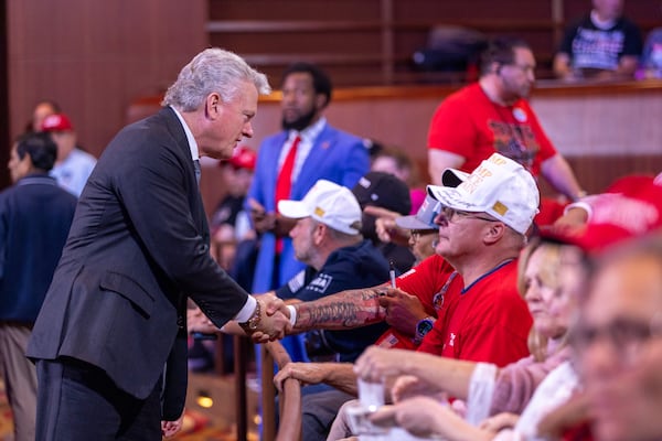 U.S. Rep. Mike Collins, R-Jackson, greeted an attendee at a Donald Trump rally in Atlanta last August.