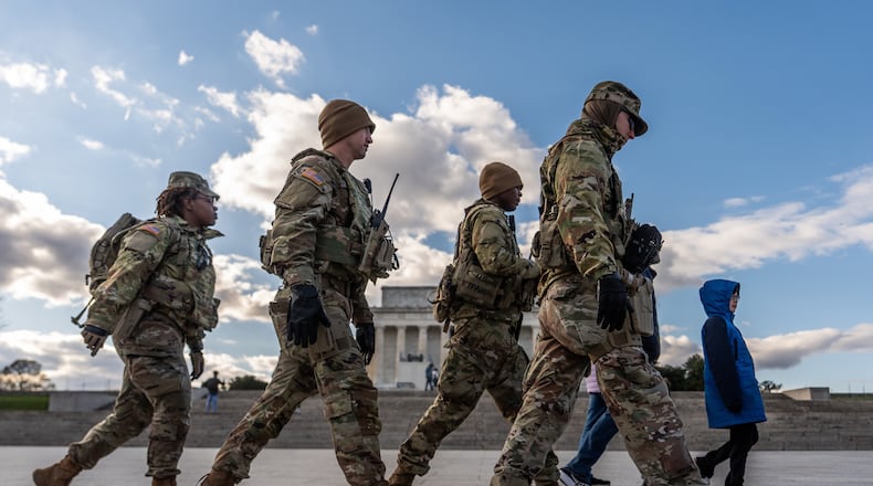 Members of the National Guard patrol in front of the Lincoln Memorial on the National Mall, Friday, Nov. 28, 2025, in Washington. (AP Photo/Julia Demaree Nikhinson)
